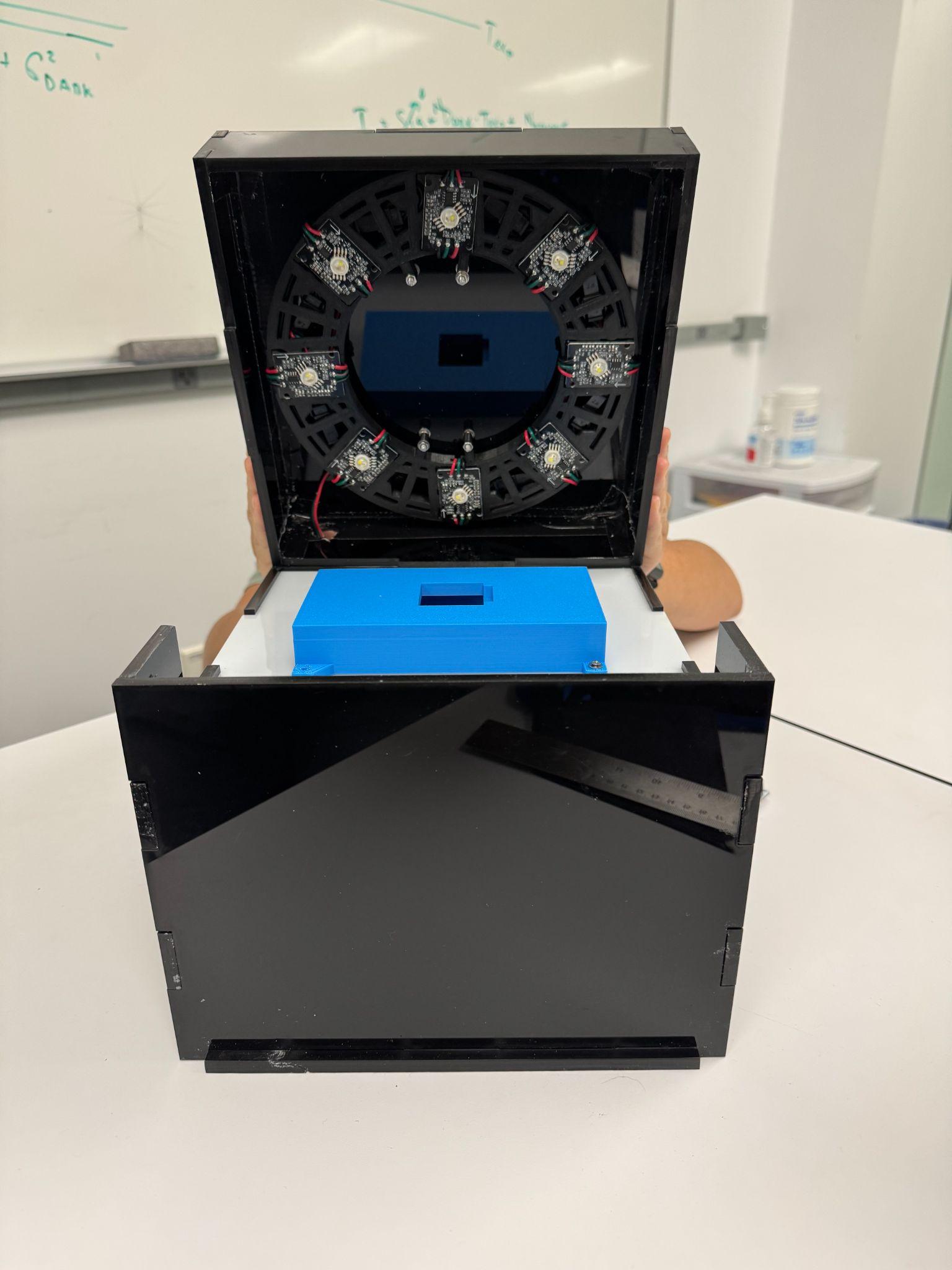 Inside: the LED ring, diffuser, and camera mount in the lid